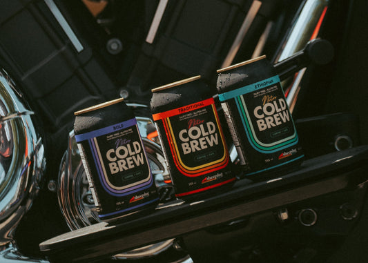 Can of nitro cold brew coffee. The cans are black with Sheepdog branding. 